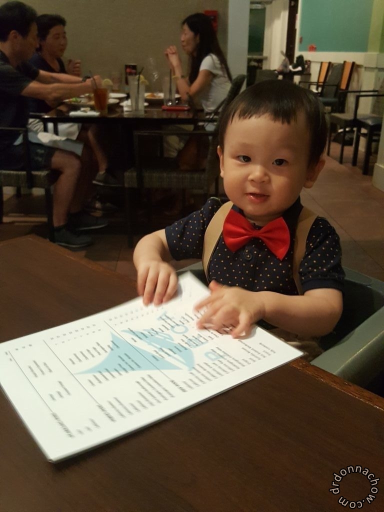 Studying the menu in Proa Restaurant