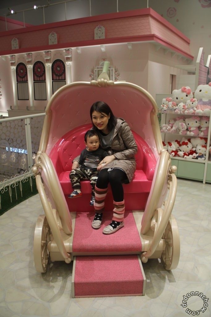 Sitting in the carriage at Hello Kitty land