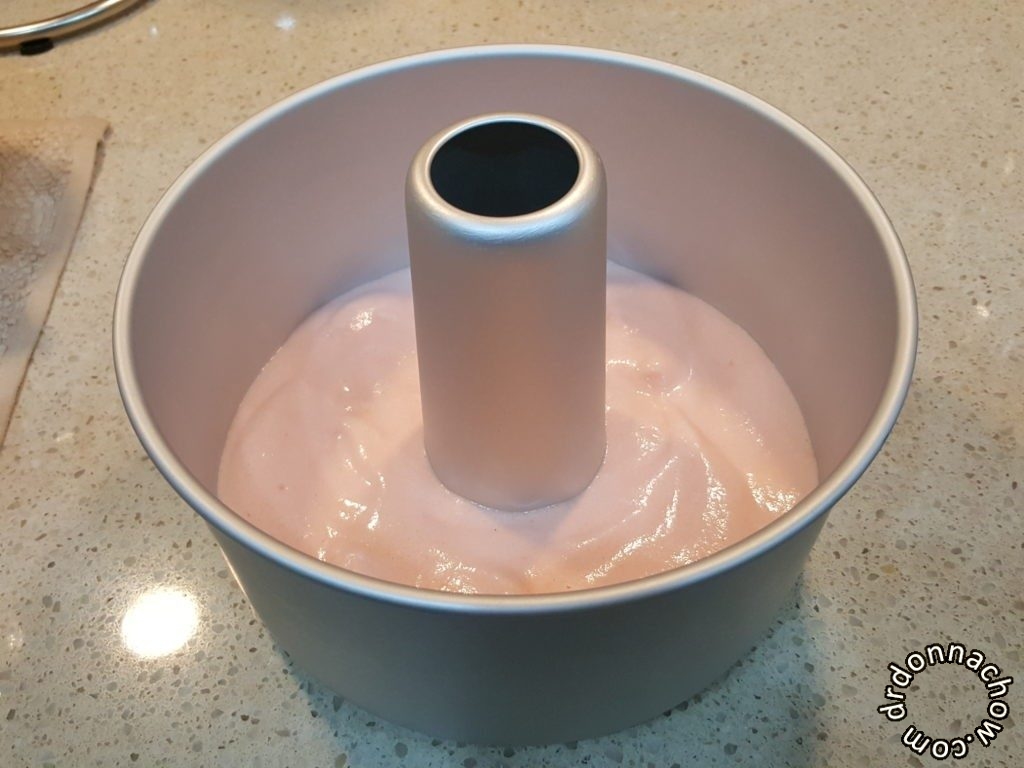 Adding in pink meringue-batter